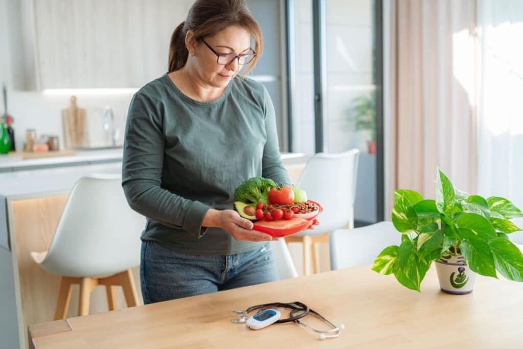 Woman holding healthy food, representing positive lifestyle changes, balanced nutrition, and small daily habits that helped build confidence in managing Type 1 diabetes.